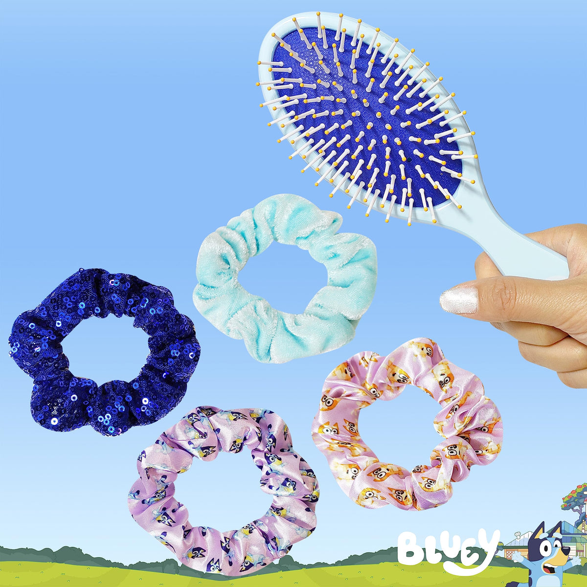 Front view of Bluey detangling hairbrush with colourful design