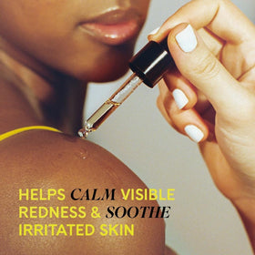 Fur Oil 14ml bottle with dropper in use