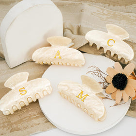 Fycert Initial Hair Clip in various colors arranged