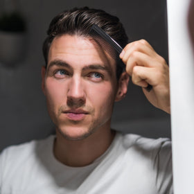 G.B.S pocket comb in hand for travel styling
