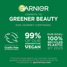 Garnier Clearly Brighter Anti-Puff Eye Roller with a fresh mint leaf background