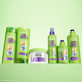 Garnier Curl Nourish Conditioner application on curly hair