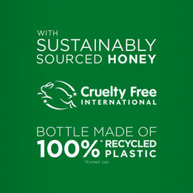 Garnier Whole Blends Repairing Shampoo Honey Treasures in a bathroom setting