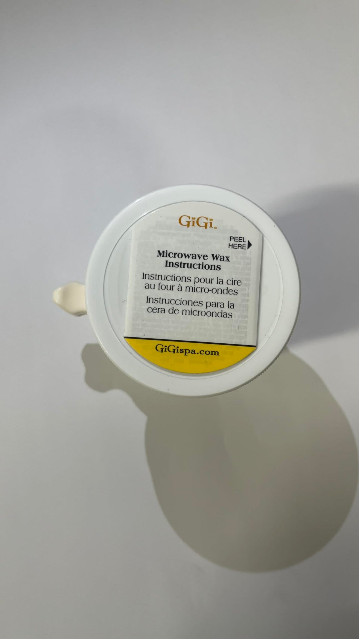 GIGI Hemp Wax Microwave 7.6 oz lifestyle scene with user