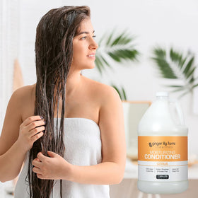 Ginger Lily Farms Citrus Moisturizing Conditioner 1 gallon displayed in a spa