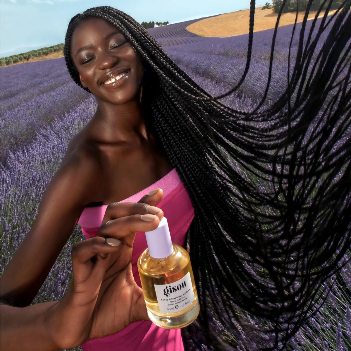Gisou Honey Infused Hair Perfume Lavender Berry in lifestyle setting