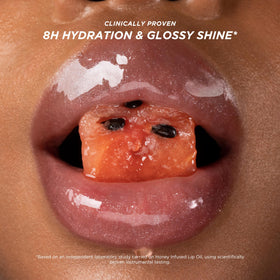 Gisou Honey Infused Lip Oil Watermelon Sugar in hand