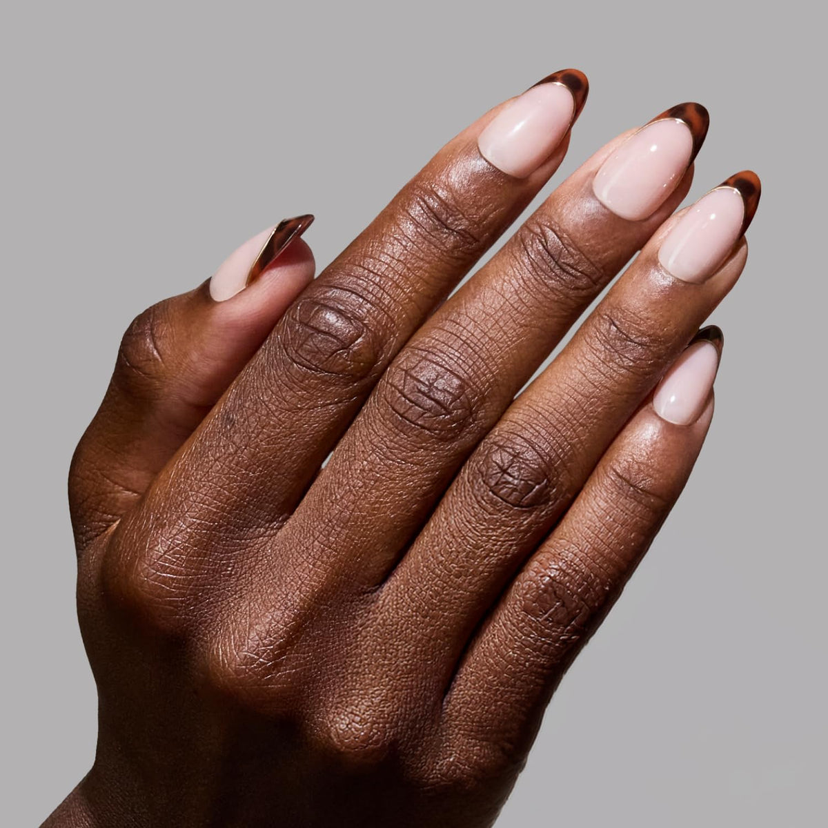 Glamnetic Press On Nails medium oval tortoiseshell French tips front view