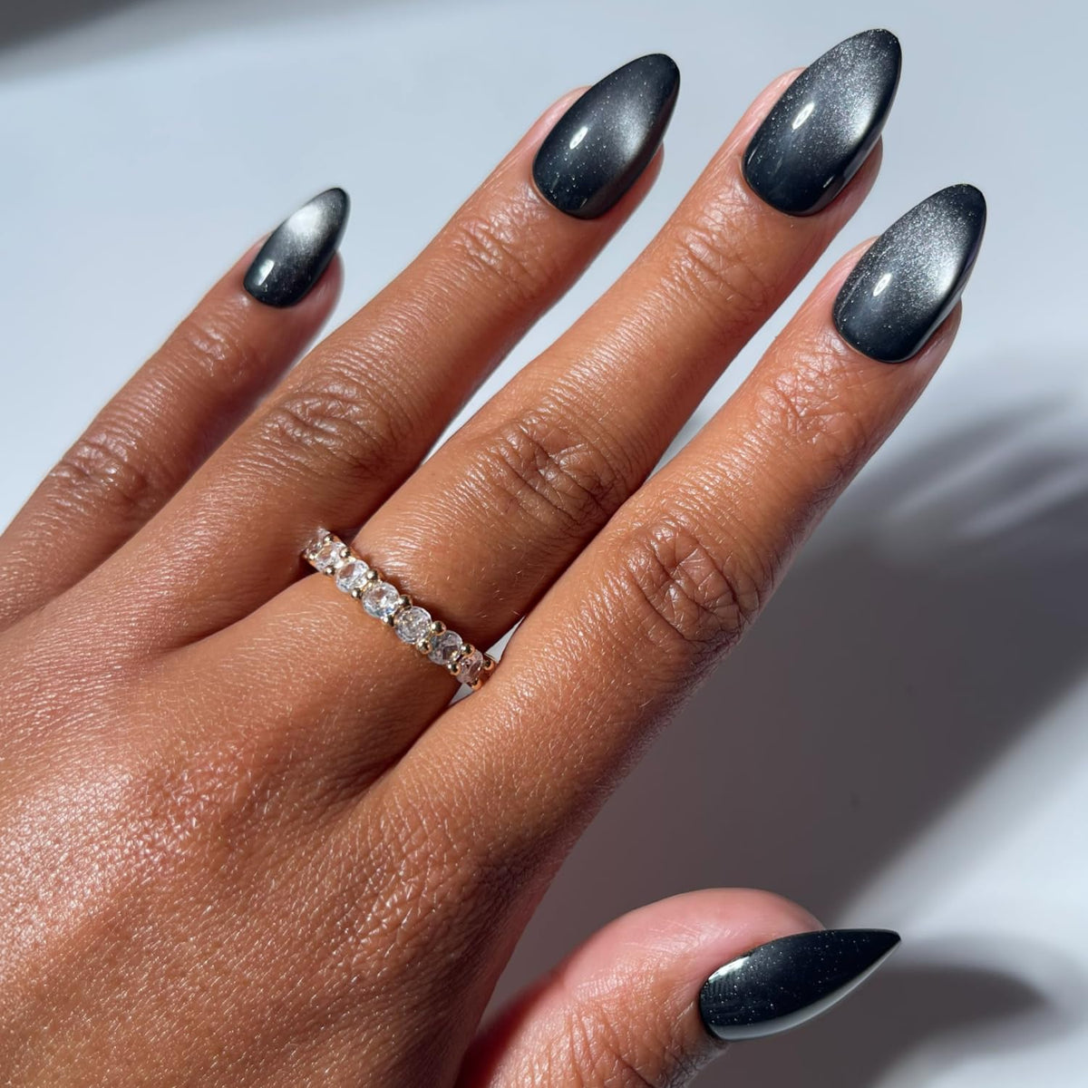Glamnetic Press On Nails short almond black velvet cat-eye effect front view