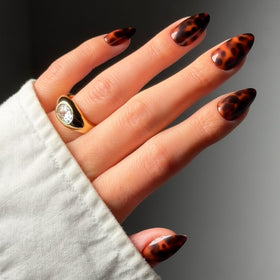 Glamnetic Short Almond Press On Nails glossy tortoiseshell design front view