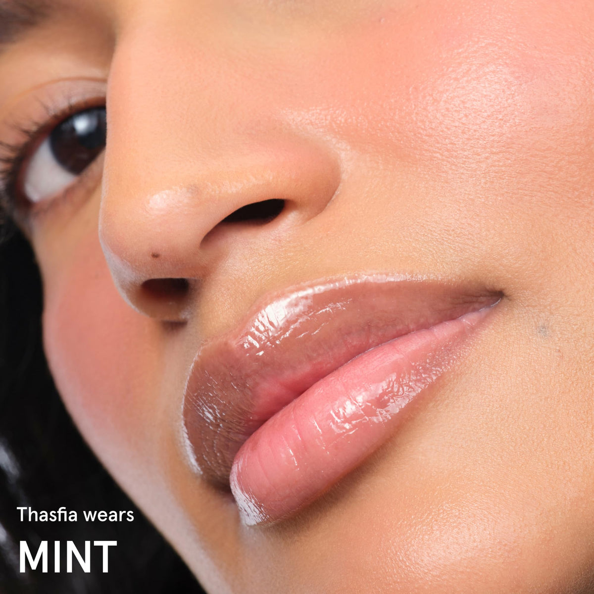 Glossier Balm Dotcom Lip Balm Mint on a bathroom counter