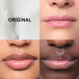 Glossier Balm Dotcom Lip Balm next to other beauty products