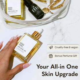 GODA Silk Body Oil 200g with a hand applying the oil on skin