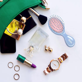 Goiio Mini Wet Hair Brush in a travel bag