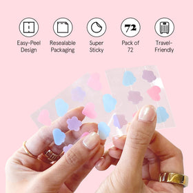 grace & stella hydrocolloid acne patches in a hand
