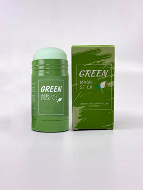 Green Mask Stick Green Tea cleansing mask in hand