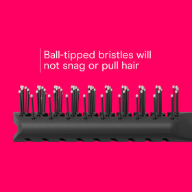Grooved nonslip handle of Conair hairbrush for comfort