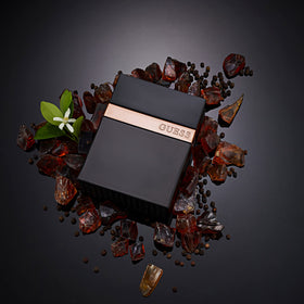 GUESS Seductive Noir Eau de Toilette on a wooden surface