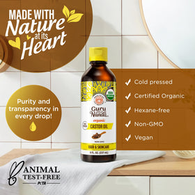 GuruNanda Castor Oil Organic 8 Fl oz on a wooden table