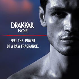 Guy Laroche Drakkar Noir bottle on a wooden table