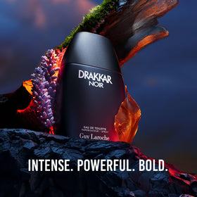 Guy Laroche Drakkar Noir bottle with aromatic spices background