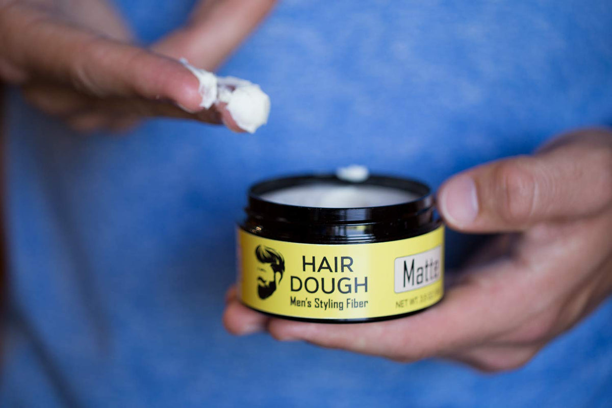 Hair Dough Styling Clay on a wooden surface