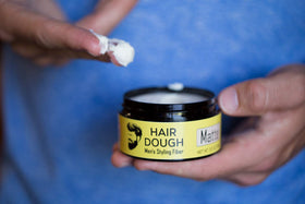Hair Dough Styling Clay on a wooden surface
