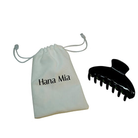 Hana Mia black claw clip in carrying bag for travel