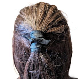 Handmade leather hair wrap in use on ponytail