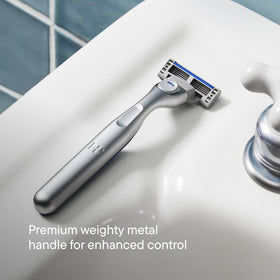 Harry's Plus Shaving Kit components laid out on a bathroom counter