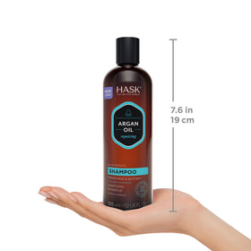 HASK Argan Oil Shampoo and Conditioner Set on a bathroom shelf