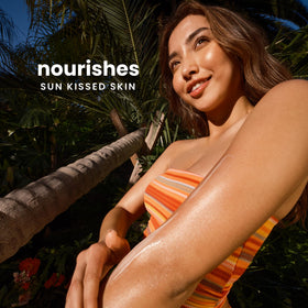 Hawaiian Tropic After Sun Body Butter 300g on a beach towel