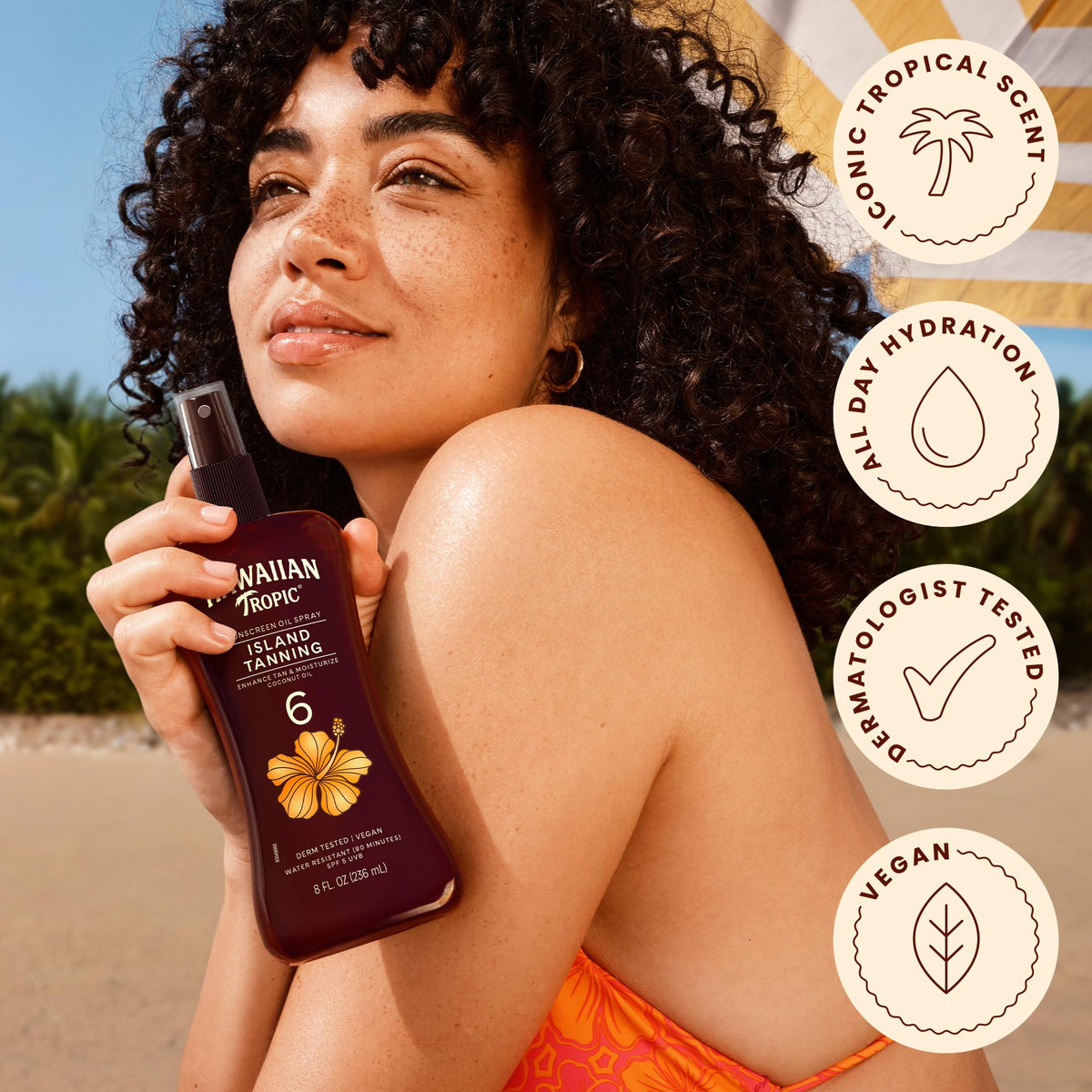 Hawaiian Tropic Dark Tanning Oil Spray with tropical backdrop
