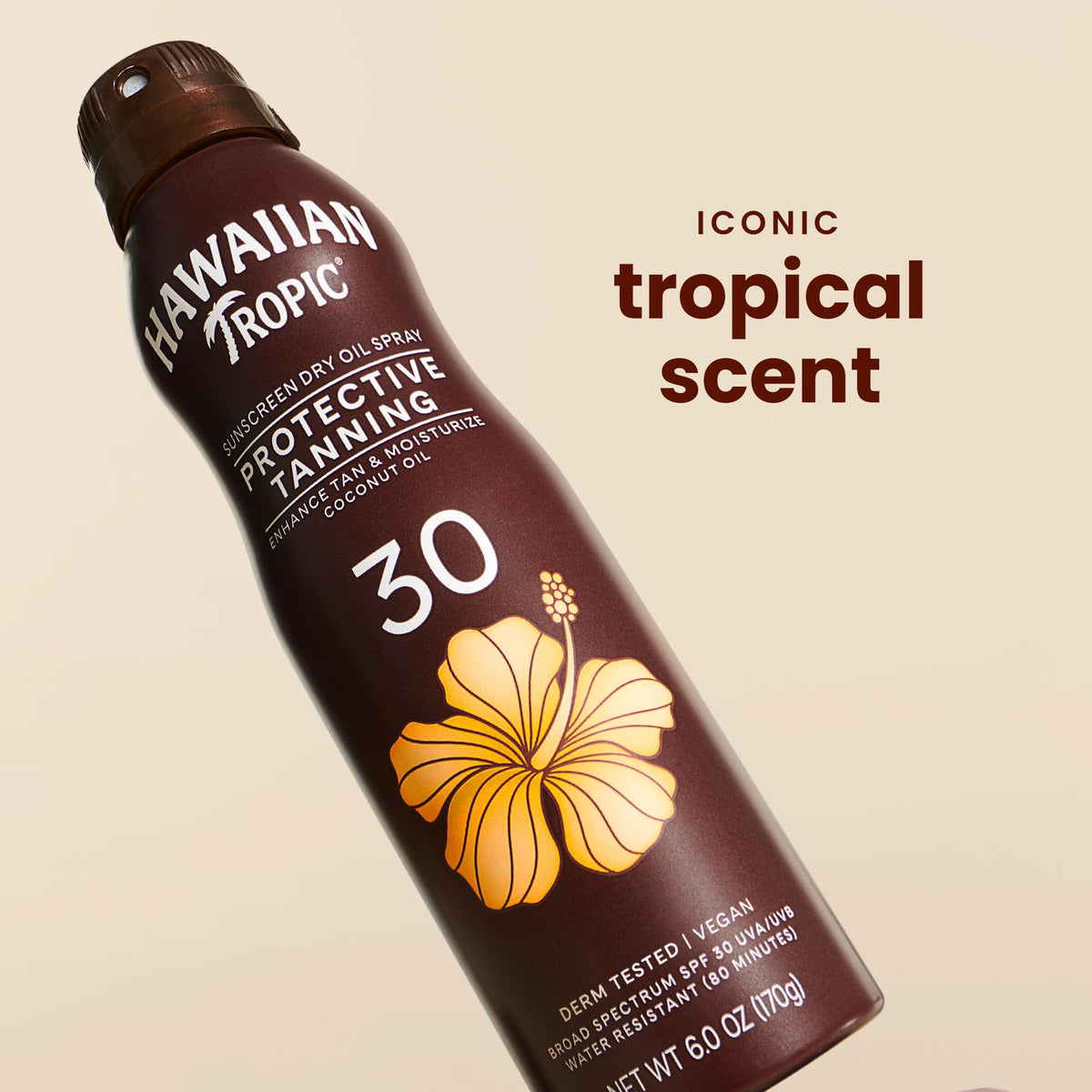 Hawaiian Tropic tanning lotion on a beach towel