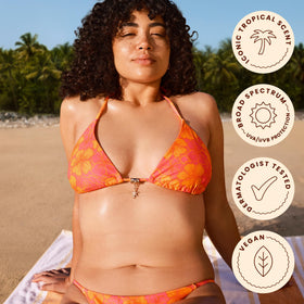 Hawaiian Tropic Water Mist SPF 30 with tropical background