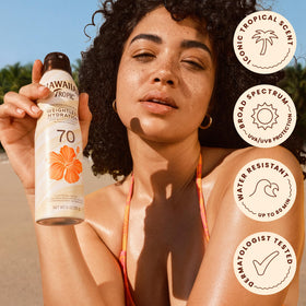 Hawaiian Tropic Weightless Hydration SPF 70 Sunscreen Spray with tropical plants