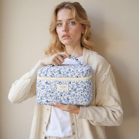 HBselect makeup bags in a travel setting