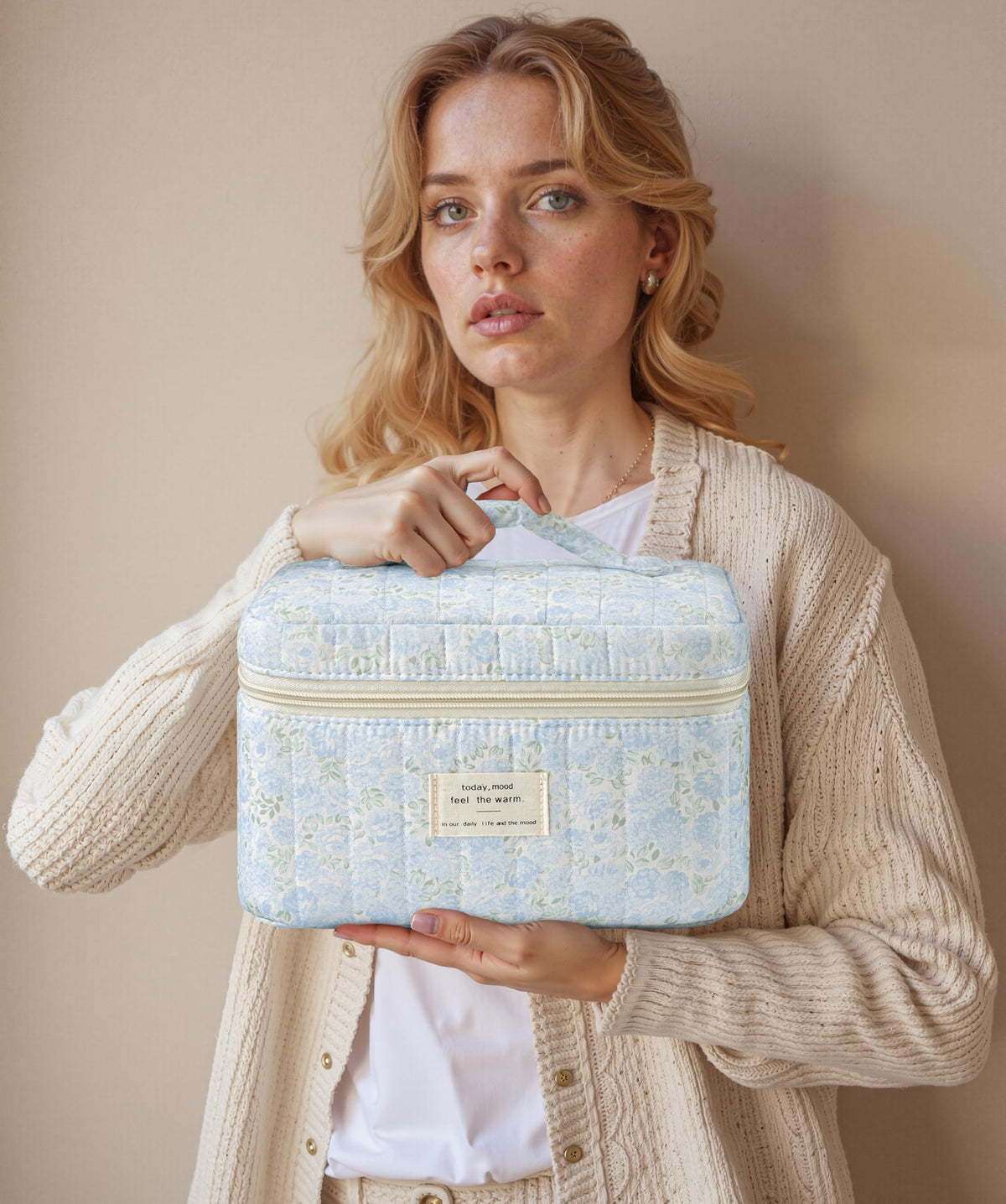 HBselect Quilted Makeup Bag Set folded and placed in a suitcase