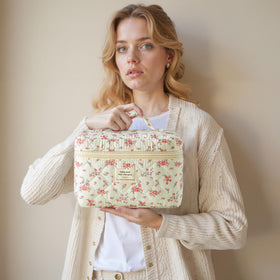 HBselect Quilted Makeup Bag Set folded in a suitcase for travel