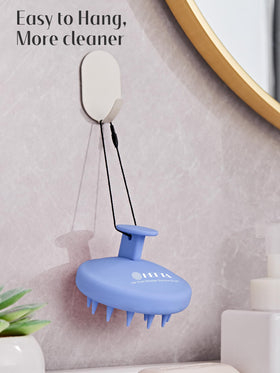 HEETA Silicone Scalp Massager in a relaxing bathroom setting