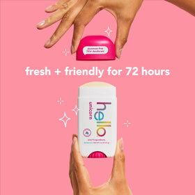 hello Unicorn Deodorant on a countertop next to flowers