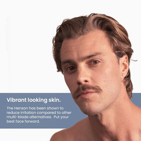 Henson Shaving Razor in hand for demonstration