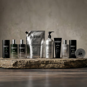 Herban Cowboy Body Soap displayed with other products
