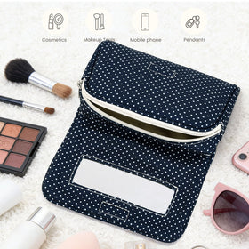Hibilog makeup bag in lifestyle setting with accessories