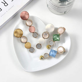 Hollow geometric hair clips from Mehayi in a variety of colours