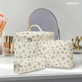 honitty floral cosmetic bag on a dresser