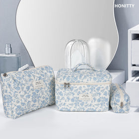 honitty Floral Makeup Bag Set packed in a suitcase