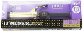 HOT TOOLS 24K Gold Curling Iron displayed on a vanity