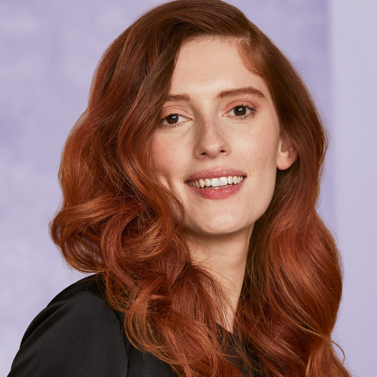 HOT TOOLS curling iron in use creating defined curls