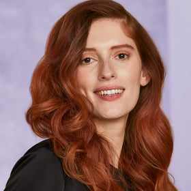 HOT TOOLS curling iron in use creating defined curls